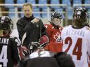 Team Canada head coach Peter Smith gives instructions during the team's practice at the Women's World Hockey Championships in Harbin, China, April 3, 2008.