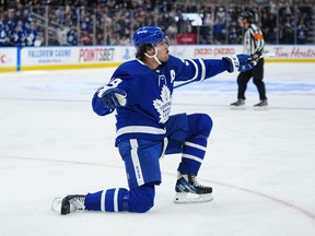 Toronto Maple Leafs forward Auston Matthews celebrates a goal at Scotiabank Arena in April. You won't be celebrating when you see the total cost of a ticket, hot dog, drink and parking at the arena.