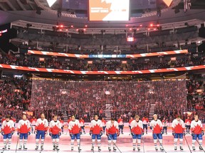 The Montreal Canadiens (white jerseys) and Toronto Maple Leafs (red jerseys) wear commemorative Team Canada jerseys during a pregame ceremony to honour the 50th anniversary of the 1972 Canada-Soviet Union hockey series, at Scotiabank Arena in Toronto on Wednesday, Sept. 28, 2022.