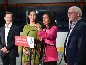 Quebec Liberal Leader Dominique Anglade responds to reporters' questions at a news conference, Wednesday, Aug. 31, 2022, in St-Agapit, Que. From the left, candidates Frederic Beauchemin, Marwah Rizqy, Dominique Anglade and Normand Cote. Quebecers are going to the polls for a general election on Oct. 3.