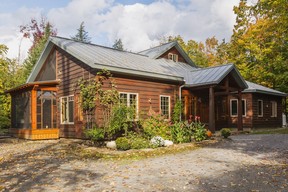 The exterior of the timber frame home features white pine planks stained a cedar colour.