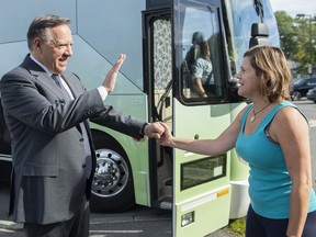 Coalition Avenir Quebec Leader Francois Legault greets a supporter during an election campaign stop in Montreal Sept. 3, 2022.