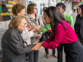 Quebec Liberal Leader Dominique Anglade greets supporters during a campaign stop in a riding office Montreal, Monday, Sept. 26, 2022.