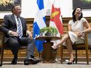 Coalition Avenir Québec Leader François Legault and Montreal Mayor Valérie Plante share a laugh prior to a meeting in Montreal on Tuesday, Sept. 13, 2022.