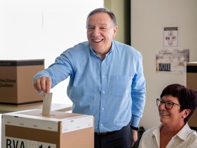 Coalition Avenir Québec Leader François Legault casts his ballot ahead of the election during a campaign stop in L'Assomption on Sunday, September 25, 2022.