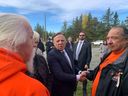 CAQ Leader François Legault (centre) meets with residential school survivors Johnny Wylde (right) and Édouard Kistabish (left) in Saint-Marc-de-Figuery on Friday, Sept. 30, 2022.