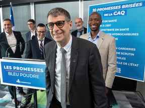 Quebec Conservative Party leader Éric Duhaime leaves the podium after speaking to the media while campaigning, Monday, Sept. 26, 2022, in Laval.