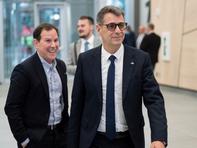 Quebec Conservative Leader Eric Duhaime, right, arrives for a leaders debate in Montreal Sept. 22, 2022. Quebecers go to the polls Oct. 3.