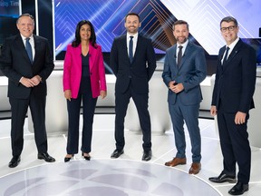 Coalition Avenir Québec Leader François Legault, Quebec Liberal Leader Dominique Anglade, Parti Québécois Leader Paul St-Pierre Plamondon, Québec solidaire Leader Gabriel Nadeau-Dubois and Quebec Conservative Leader Éric Duhaime pose on set prior to a leaders debate in Montreal, Thursday, September 22, 2022. Quebecers will go to the polls on October 3rd.