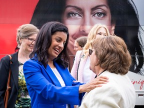 Liberal Leader Dominique Anglade greets a supporter during a campaign stop in Boucherville Sept. 13, 2022.