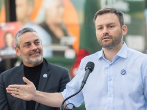 Parti Québécois candidate Pierre Nantel looks on as PQ Leader Paul St-Pierre Plamondon speaks during a news conference at an election campaign stop in Montreal, Saturday, Sept. 17, 2022.