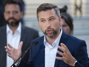 Québec solidaire co-spokesperson Gabriel Nadeau-Dubois speaks to the media while campaigning Tuesday, August 30, 2022 in Montreal.