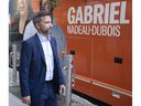 Québec solidaire co-spokesperson Gabriel Nadeau-Dubois walks to his bus while campaigning Tuesday, Aug. 30, 2022 in Montreal.