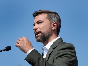 Québec solidaire co-spokesperson Gabriel Nadeau-Dubois speaks to the media  while campaigning Wednesday, September 7, 2022  in Montreal.