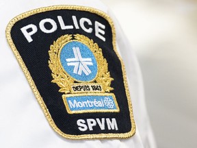 A Montreal police badge is shown during a news conference by Public Safety Minister Marco Mendicino in Montreal, Thursday, August 4, 2022, where he announced federal support for organizations on the front lines of the fight against gun and gang violence in Quebec.