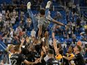CF Montreal players toss head coach Wilfried Nancy into the air after Friday night's 2-2 draw with the Columbus Crew in front of a sold-out crowd at Stade Saputo that secured an MLS playoff berth for the team.