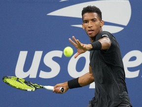 Felix Auger-Aliassime of Canada hits a shot against Jack Draper of Great Britain on Day 3 of the 2022 U.S. Open tennis tournament at USTA Billie Jean King Tennis Center in New York on Aug. 31, 2022.