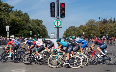 Riders speed around a turn during the Grand Prix Cyclistes race in Montreal on Sept. 11, 2022.