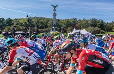 Riders in Montreal's Grand Prix Cyclistes race pass the Sir George-Étienne Cartier monument on Sept. 11, 2022.