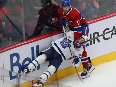 Canadiens' Josh Anderson (17) brings down Toronto Maple Leafs' Rasmus Sandin (38) during third period NHL action in Montreal on Wednesday October 12, 2022.