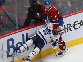 Montreal Canadiens' Josh Anderson brings down Toronto Maple Leafs' Rasmus Sandin during third period in Montreal on Oct. 12, 2022.