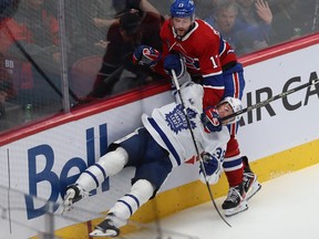 Montreal Canadiens' Josh Anderson brings down Toronto Maple Leafs' Rasmus Sandin during third period in Montreal on Oct. 12, 2022.