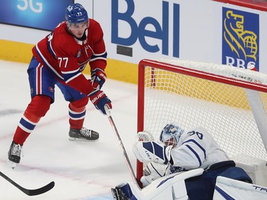Canadiens' Kirby Dach (77) tries to jam the puck behind Toronto Maple Leafs goaltender Matt Murray during second period NHL action in Montreal on Wednesday Oct. 12, 2022.