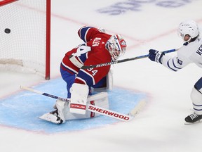 Canadiens goaltender Jake Allen deflects a penalty shot from Toronto Maple Leafs' Alexander Kerfoot (15) away from the goal during second period NHL action in Montreal on Wednesday Oct. 12, 2022.
