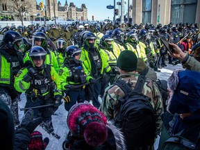 Police from forces across the country joined together to try to bring the "Freedom Convoy" occupation to an end Saturday, Feb. 19, 2022.
