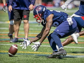 Alouettes defenseman Tyrice Beverette picks up the ball during a fumble drill in practice at the Montreal Alouettes training camp in Trois-Rivières on May 25, 2022.