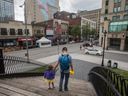 Riley Drever and daughter Esmée in Dorchester Square in May 2022. One of the biggest challenges facing Montreal is how to revive downtown.