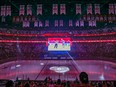 Tghe Montreal Canadiens stage a light show prior to fans watching Game 2 of the Stanley Cup finals against the Tampa Bay Lightning on the big screen at the Bell Centre in Montreal on June 30, 2021. The Habs and Lightning were playing the game in Tampa.