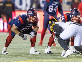 Montreal Alouettes offensive-linemen Kristian Matte, left, and Sean Jamieson line up against the Hamilton Tiger-Cats during second half in Montreal on Sept. 23, 2022.