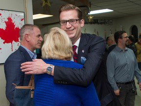 Colin Standish, leader of the Canadian Party of Quebec, embraces a member of his team at the Royal Canadian Legion hall in N.D.G. on Monday, Oct. 3, 2022, on election night.