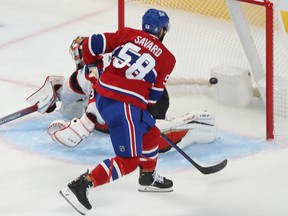 Montreal Canadiens' David Savard (58) scores on Ottawa Senators goaltender Anton Forsberg during second period pre-season NHL action in Montreal on Tuesday Oct. 4, 2022.