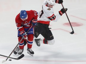 Ottawa Senators' Shane Pinto (57) jumps around Montreal Canadiens' Cole Caufield (22) during third period pre-season NHL action in Montreal on Tuesday Oct. 4, 2022.