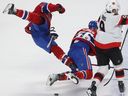 Montreal Canadiens' Jake Evans (71) goes over teammate Jesse Ylonen (56), next to Ottawa Senators' Josh Norris (9) during first period pre-season NHL action in Montreal on Tuesday Oct. 4, 2022.