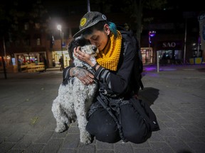 Josine sits with her Aussiedoodle, Barbie, near the Beaudry métro station on Tuesday, October 11, 2022. She was interviewed during the census of Montreal's unhoused population.