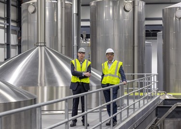 General manager Tim Crease, left, with company president Frederic Landtmeters at the Molson Coors brewery in Longueuil.