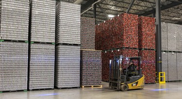 A forklift drives through the warehouse at the Molson Coors brewery in Longueuil.