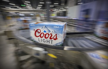 Cases of Coors Light roll along the assembly line at the Molson Coors brewery in Longueuil.