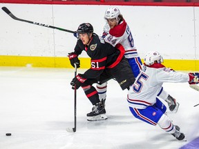 Canadiens' William Trudeau, top, battles Ottawa Senators' Cole Reinhardt during rookie game in Ottawa on 
Sept. 18, 2021.