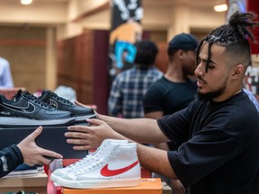 Third year McGill University Social Work student Julian Grau-Brown donated a pair of sneakers to every student at James Lyng High School in St-Henri.