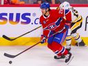 Montreal Canadiens defenceman Johnathan Kovacevic skates sway from Pittsburgh Penguins' Jason Zucker during third period in Montreal on Oct. 17, 2022.