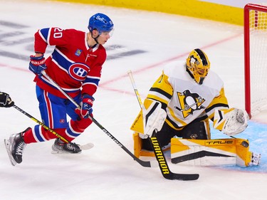 Canadiens' Juraj Slavkovsky chases down a rebound on a save by Pittsburgh Penguins' Casey DeSmith during the second period at the Bell Centre in Montreal Monday Oct. 17, 2022.