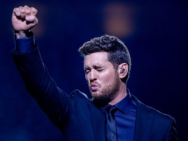 Michael Bublé strikes a pose for photographers during his show at the Bell Centre in Montreal Tuesday Oct. 18, 2022.
