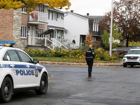 Laval police at the scene of double homicide. Two kids were found dead in the house on Lauzon St. on Oct. 17.