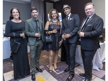 Josyane Desgagnes, left, with her husband, Etiennd Bourdages, Tanya Nasehoglu with husband Ralph Karawani and Eric Bernard at a fundraiser cocktail for La Fondation immobilière de Montréal pour les jeunes at the Queen Elizabeth Hotel in Montreal on Friday, Oct. 21, 2022.