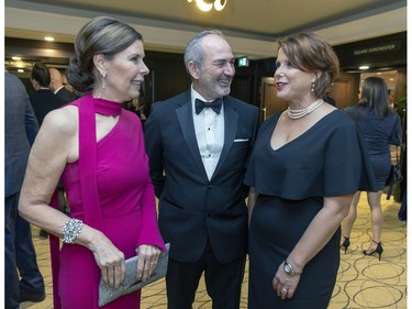 Board members Sonia Gagnon, left, and Isabelle Heroux flank Yves Vaillancourt at a fundraiser cocktail for La Fondation immobilière de Montréal pour les jeunes at the Queen Elizabeth Hotel in Montreal on Friday, Oct. 21, 2022.