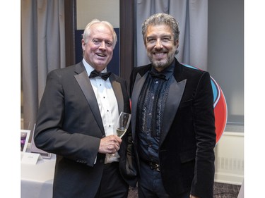 Master of ceremony Jean Airoldi, right, with board member Jacques Laplante at a fundraiser cocktail for La Fondation immobilière de Montréal pour les jeunes at the Queen Elizabeth Hotel in Montreal on Friday, Oct. 21, 2022.